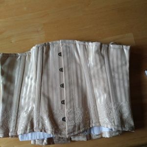 Cream colored under bust corsett.